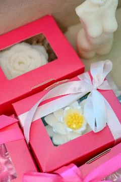 A set of handmade soaps in the shape of a white flower in a pink box Stock Photos