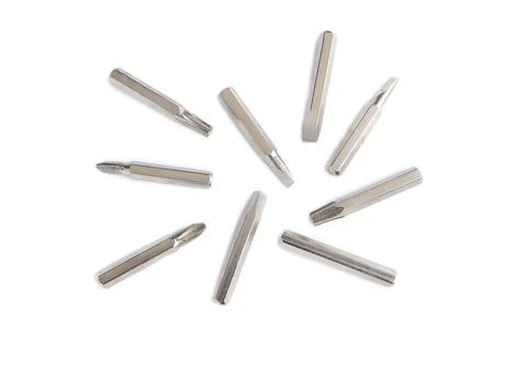 Set of heads for screwdriver (bits)  on white background. Set of working tools  Stock Photos
