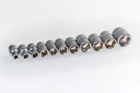 Set of the hexagonal sockets different sizes on light surface 스톡 사진