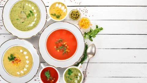 Set of hot, colored vegetable soups. Broccoli soup, corn, tomato soup. Health Stock Photos