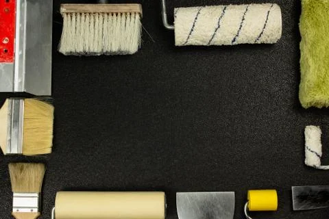 Set of house painter tools on black background with copy space, top view, fla 库存照片
