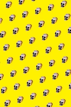 Set of illustrated skull composing rhomb on yellow backdrop Stock Illustration