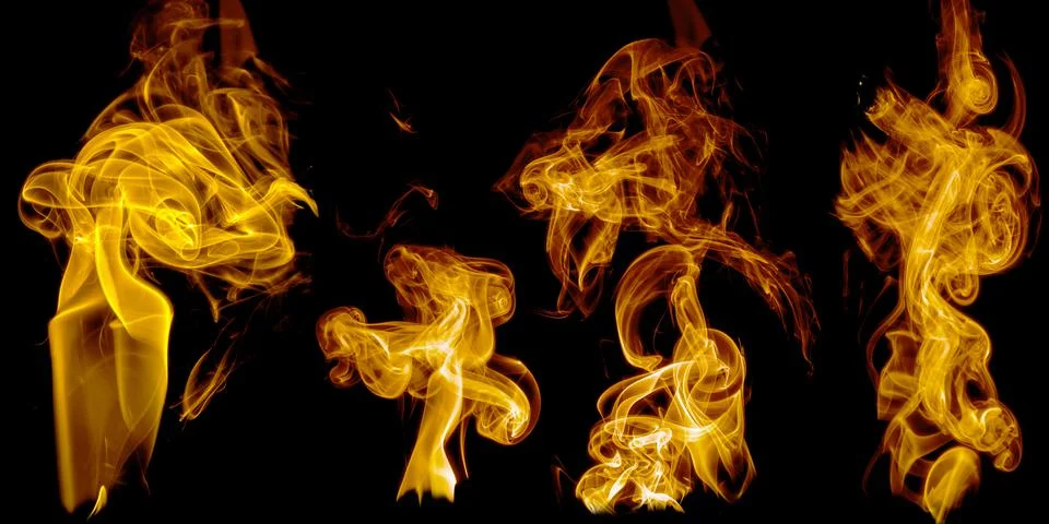 A set of isolated samples of orange smoke on a black background. Stock Photos