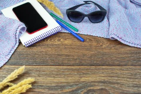 Set of items office mobile notebook sketch pencils markers eraser glasses Woo Stock Photos