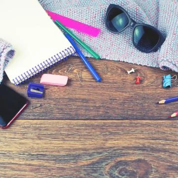 Set of items office mobile notebook sketch pencils markers eraser glasses Woo Stock Photos