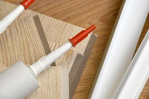 Set of items for PVC ceiling indoor works. Assembly adhesive bottles and PVC  Stock Photos