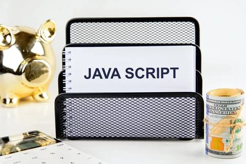 A set of JavaScript notes is prominently featured on a desk organizer. Nearby Stock-Fotos