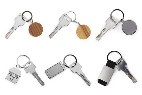 Set of keys with key chains isolated on white Foto stock