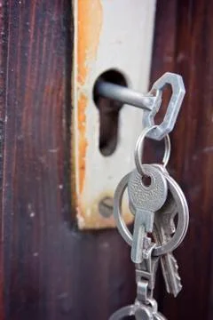 Set of keys in an old rustic lock Stock Photos