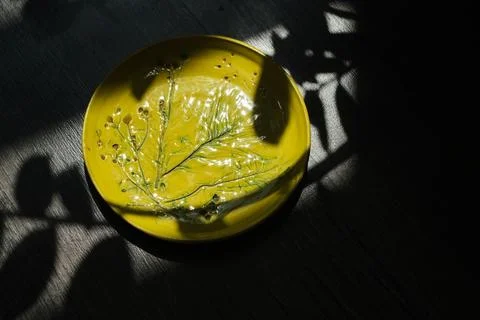 Set of kitchen ceramic tableware on a table. Eco style home still life. Stockfoto's