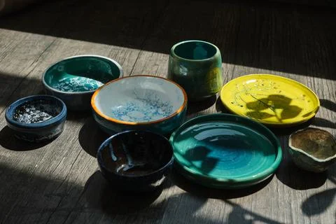 Set of kitchen ceramic tableware on a table. Eco style home still life. Stock-Fotos