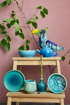 Set of kitchen ceramic tableware on a table. Eco style home still life. 库存照片