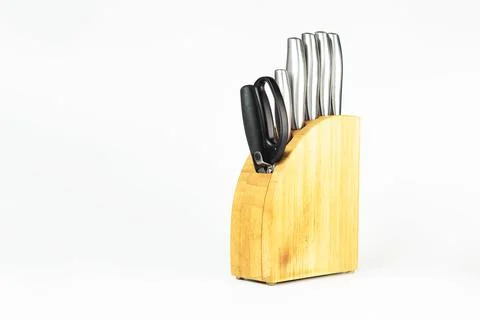 Set of kitchen knives with scissors on a white background. Stock Photos