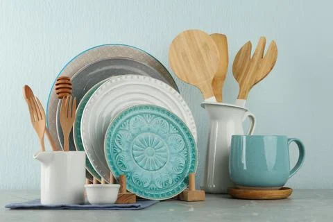 Set of kitchenware on grey marble table near light wall. Modern interior desi Stock Photos