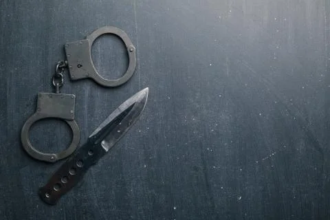 Set of knife and handcuff Stock Photos