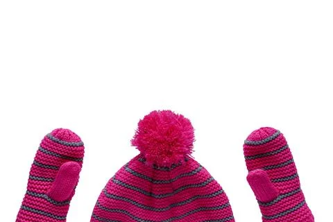 Set of knitted pink hat with pompon and mittens for children isolated on whit Stock Photos