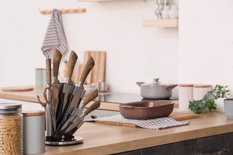 Set of knives on counter in modern kitchen Stock Photos