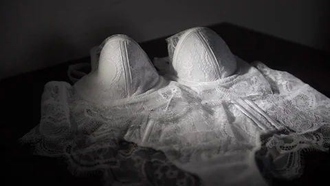 A set of lace underwear lying on the table Stock Footage 129817297