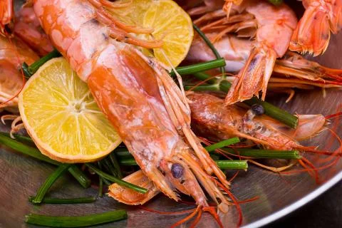 Set langoustine shell with a crest sharp on his head with a lemon delicious Stock Photos