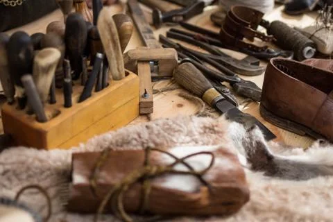 Set of leather working tools on working desk Stock Photos