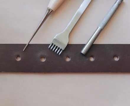 Set of leathercraft tools - Slickers, Nylon hammers, Edge Creaser, Burnishers Stock Photos
