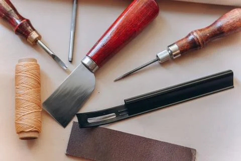 Set of leathercraft tools - Slickers, Nylon hammers, Edge Creaser, Burnishers Stock Photos