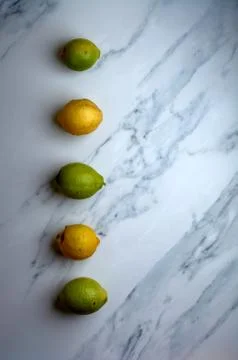 Set of lemons on a white marble background Stock Photos
