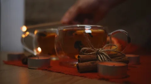 Set light to candles surrounding in apple Cider Drink, Juice, Punch, Tea with Stock Footage 121583595