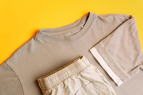 Set of light gray children's clothes T-shirt with trousers. Fashion kids outfit Stock Photos