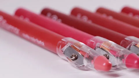Set of lip pencils with different shades on a white background, close-up. Copy Stockbeeldmateriaal 254660615