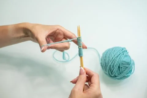 Set of loops on the needles step by step. wool and cotton knitting Stock Photos