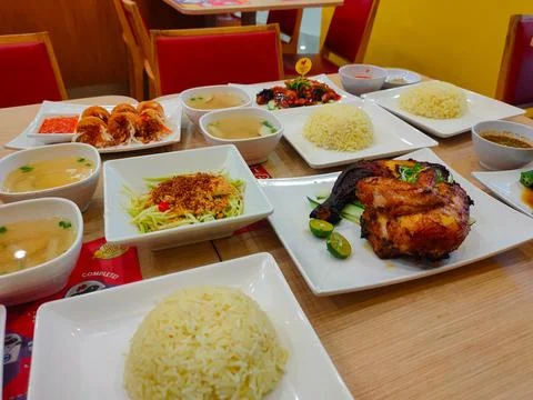 A set lunch menu served on a white plate on a dining table in a restaurant Stock Photos