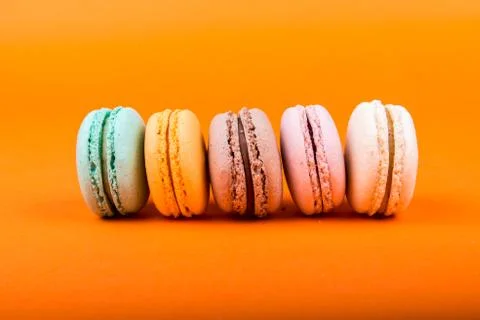 Set of macarons on orange background Stock Photos