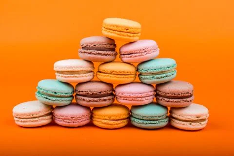 Set of macarons on orange background Stock Photos
