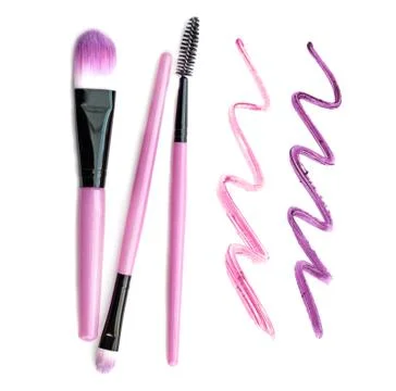 Set of make-up brushes with lipstick trace isolated on white background. Stock Photos