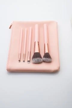 Set of Make up Brushes with Pink Leather Pouch Over White Background 写真素材