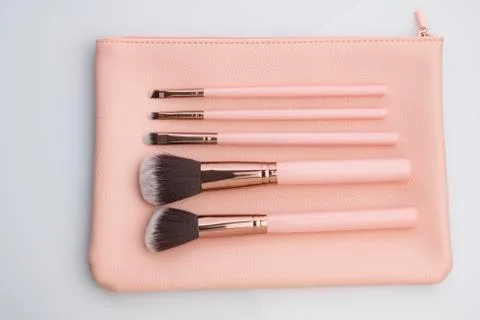 Set of Make up Brushes with Pink Leather Pouch Shot in Studio 写真素材