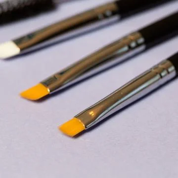 Set of makeup brushes on the table Stock Photos