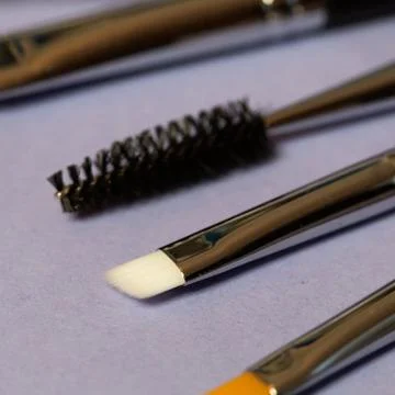 Set of makeup brushes on the table Stock Photos
