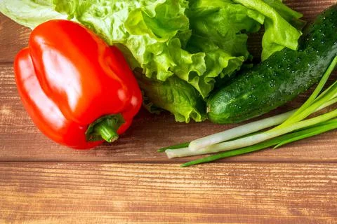 Set for making salad of fresh herbs, cucumbers and red pepper Stock Photos