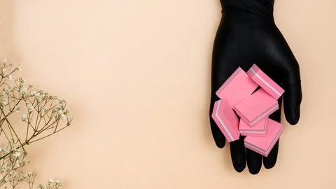 A set of manicure nail files with the same abrasive in the hand of the manicure Stock Photos