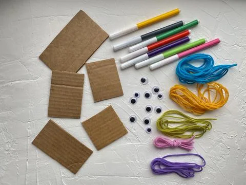A set of materials for creativity, cardboard, yarn, markers. Stock Photos