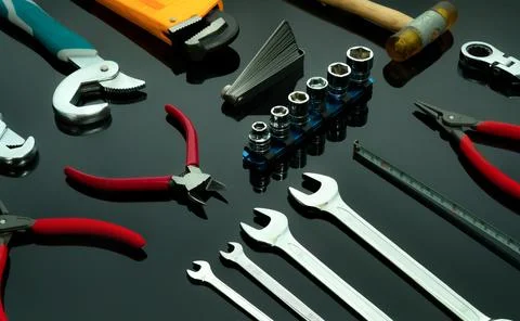 Set of mechanic tools on dark background. Chrome wrenches or spanners, hexa.. Stock Photos