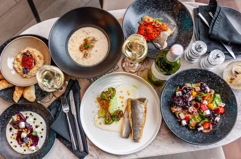 A set of Mediterranean cuisine dishes on a table in a restaurant. Stock Photos