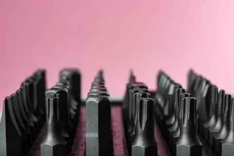 A set of metal bits for a screwdriver in plastic packaging Stock Photos