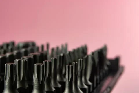 A set of metal bits for a screwdriver in plastic packaging Stock Photos
