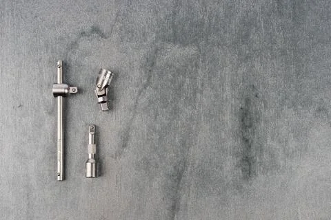 Set of metal drill bits on a gray surface Stock Photos