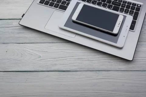 Set of modern computer devices - laptop, tablet and phone close up Stock Photos