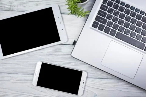 Set of modern computer devices - laptop, tablet and phone close up Stock Photos
