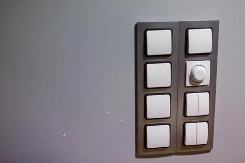 Set of modern lightswitch on grey wall. Electronic light switch. Smart home a Stock Photos